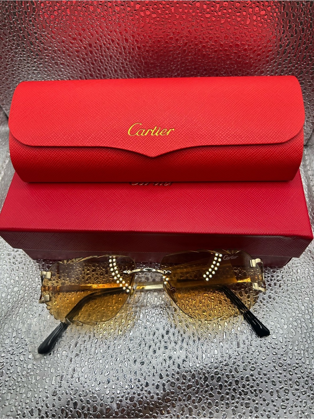 Carti Rimless Sunglasses with Amber Lenses and Red Case